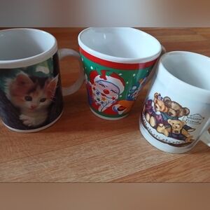 Set of Holiday and Animal Themed Mugs. In Good Condition.